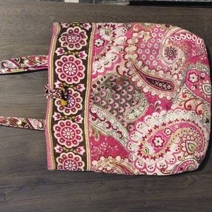 Vera Bradley pink floral quilted bag with 3 inside pockets.